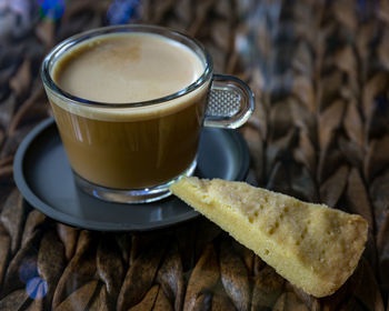 Close-up of coffee cup on table