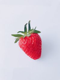 Close-up of strawberry against white background