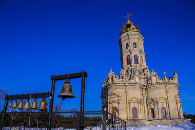 Low angle view of historical building against blue sky