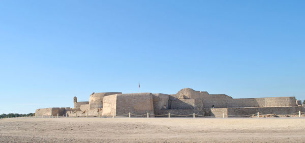 Old fort against clear blue sky