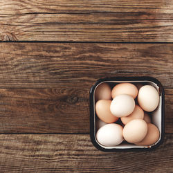 High angle view of eggs in container on table