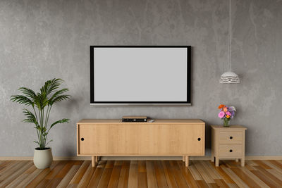 Blank television set mounted on wall at home