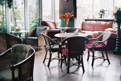 Empty chairs and tables in restaurant