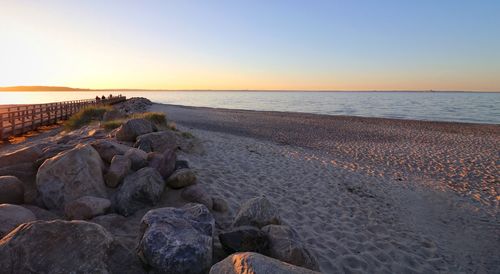 Scenic view of sea against clear sky during sunset