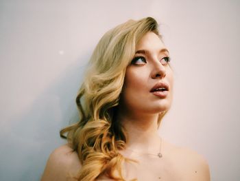 Portrait of woman against white background