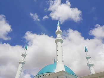 Low angle view of bell tower against sky