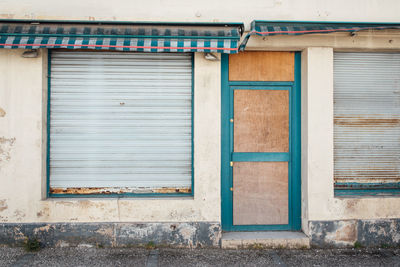 Closed door of abandoned building. old abandoned shop