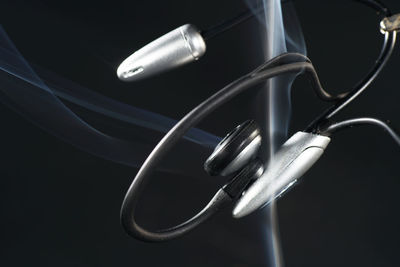 Close-up of electric lamp against black background