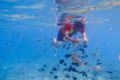 Boy swimming in sea
