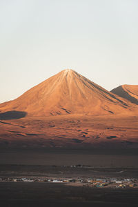 Scenic view of desert against clear sky