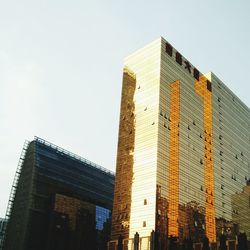 Low angle view of modern buildings against clear sky
