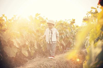 Full length of child standing in farm