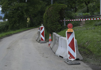 Traffic safety through barriers, road signs and traffic cone on the street