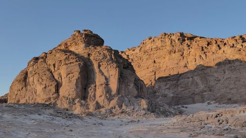  view of rock formations against sky in desert 