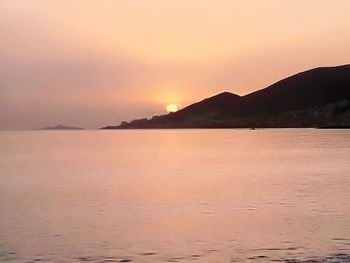 Scenic view of sea against sky at sunset