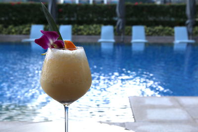 Drink against swimming pool