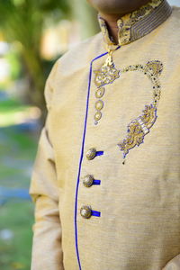Midsection of man wearing kurta