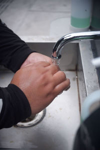 Close-up of hand holding water