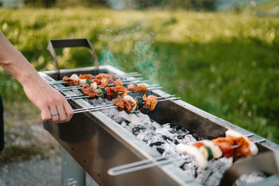 Man preparing food on barbecue grill