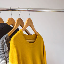 Close-up of clothes hanging on rack