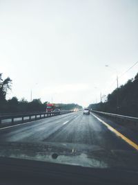 Road seen through car windshield