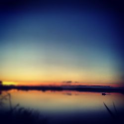 Scenic view of calm sea at sunset