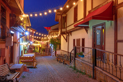 View of illuminated buildings in city at night