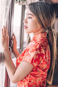 Portrait of a young woman looking away