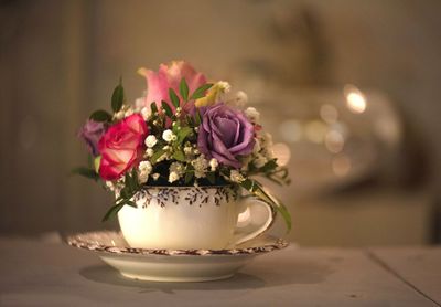 Close-up of pink flower vase on table