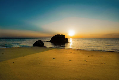 Scenic view of sea against sky during sunset