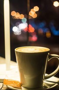 Close-up of coffee cup on table