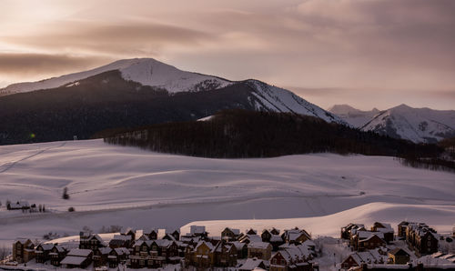 Panoramic view of snowcapped mountains against sky