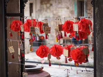 Red lanterns hanging on building in city