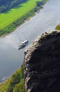 High angle view of bird flying over water