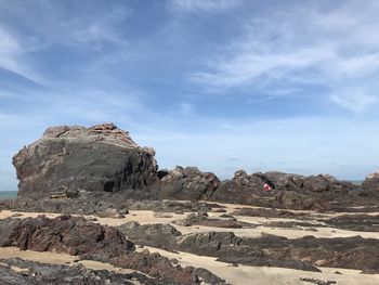 Rock formations on landscape against sky