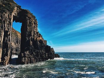 Scenic view of sea against blue sky