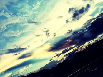 Scenic view of landscape against cloudy sky