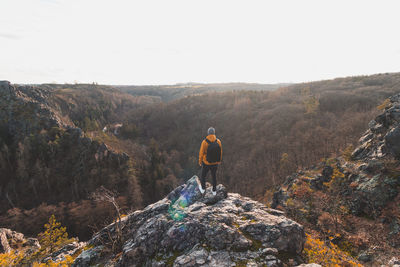 Rear view of man walking on mountain