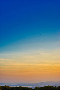 Scenic view of silhouette landscape against sky during sunset