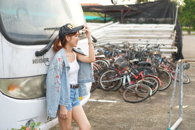 Woman looking at bicycle
