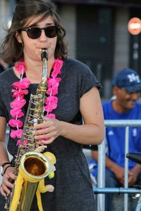 Mid adult woman wearing sunglasses at music concert