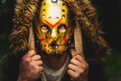 Close-up portrait of woman wearing mask