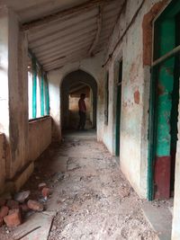 Man walking in abandoned building