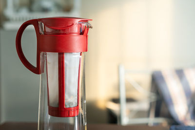 Close-up of red wine in glass on table