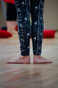 Low section of woman standing on floor