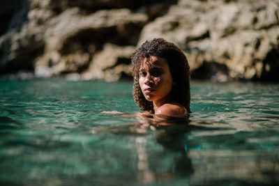 Portrait of woman swimming in pool