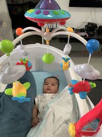 Portrait of cute boy with balloons