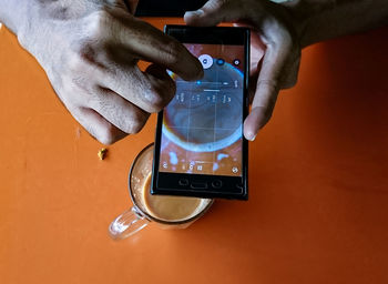 Close-up of man using mobile phone