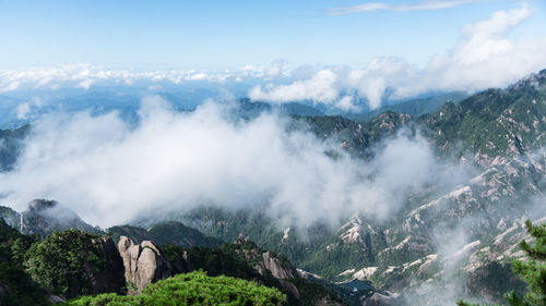 Scenic view of waterfall against sky