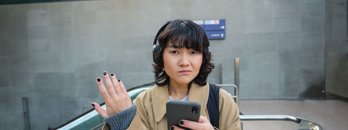 Young woman using mobile phone